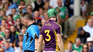 From bad to worse: referee Barry Kelly shows Matthew O'Hanlon a red card