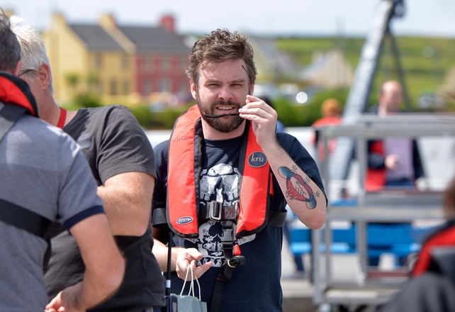 Nathan Hamill, son of actor Mark Hamill, arrives at Portmagee harbour to be transported to the set
