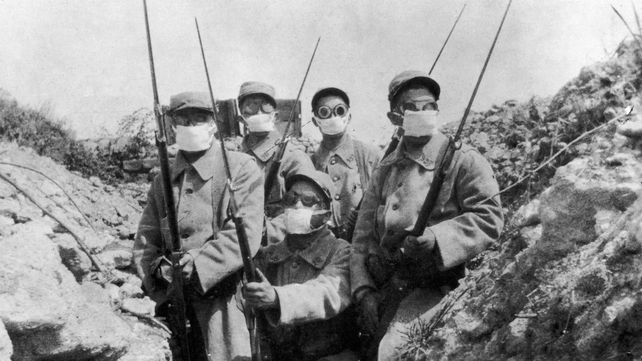 French troops wearing an early form of gas mask in the trenches during the second battle of Ypres