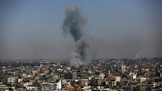 Smoke rises after an Israeli airstrike in Gaza City, hours before a four-hour humanitarian truce