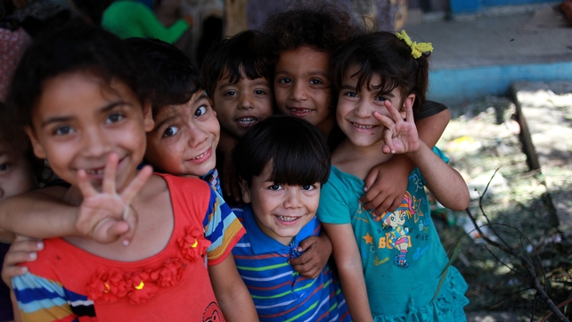 Palestinian children play at the UN school after the Israeli airstrike