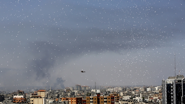 Flyers are dropped over Gaza City by the Israeli army urging residents to evacuate their homes