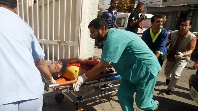 Israeli shelling killed more than 20 Palestinians and injured many more just hours after the ceasefire took effect