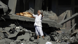 A man surveys the damage of what was once his home in northern Gaza