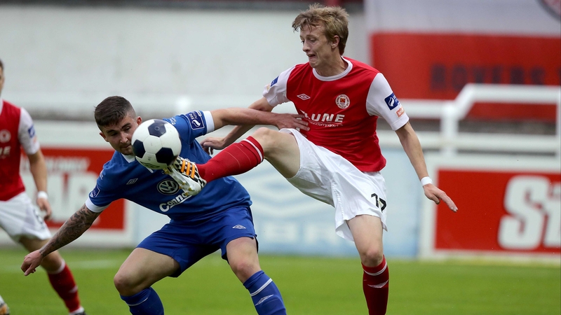 Chris Forrester of Pat's gets a toe in ahead of Sean Maguire