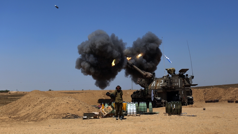 Israeli troops fire shells into Gaza