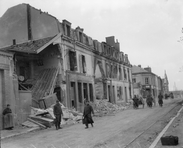 Ruined shells of buildings on a French street during World War I