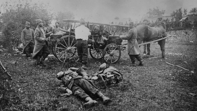 Soldiers collecting dead comrades from battlefields