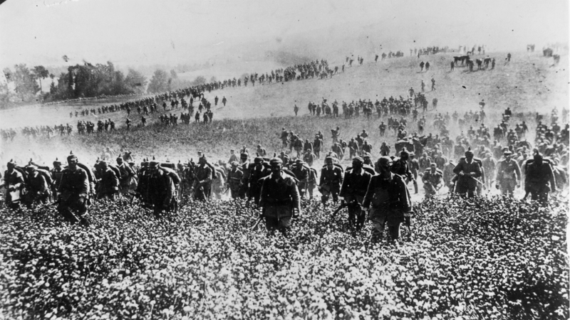 German infantry advancing across open country during the occupation of Belgium