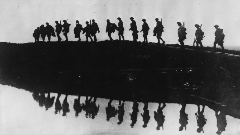 Supporting troops of the 1st Australian Division walking on a duckboard track near Hooge, in the Ypres Sector