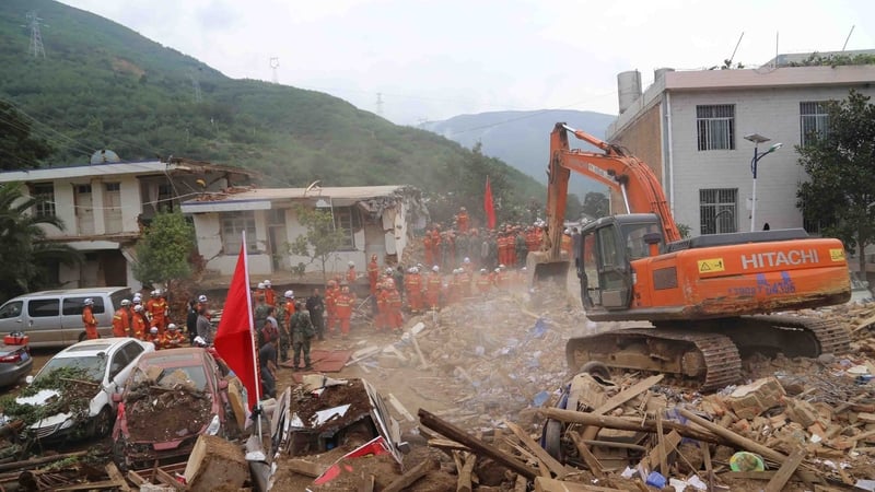 Rescue workers look for survivors among the debris after the earthquake