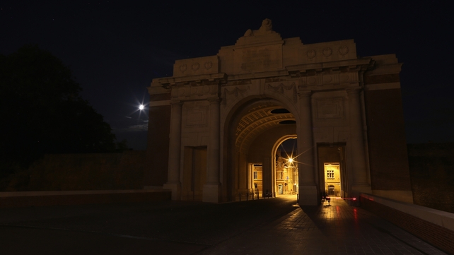 The Menin Gate Memorial in Belgium in near darkness after the lights that normally illuminate it were turned off