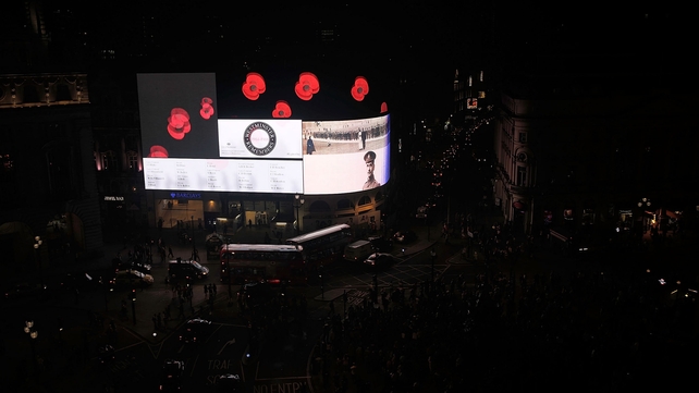 Piccadilly Circus displayed memorial images as the lights were turned off