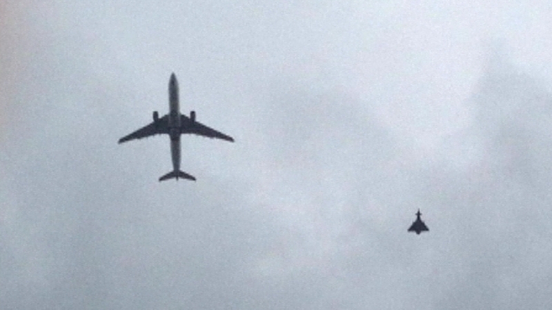 An RAF fighter jet escorted the passenger plane into Manchester Airport