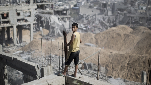 A boy looks out at the destruction in part of Gaza's al-Tufah neighbourhood