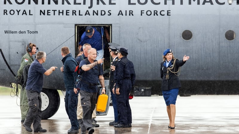 Members of the repatriation mission who were active in the area of the MH17 plane crash arrive at the Eindhoven airbase