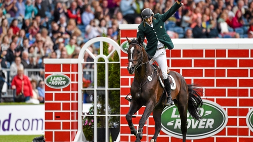 Michael Hutchinson on Acorad 3, celebrates after clearing the wall at 7 feet 3 inches