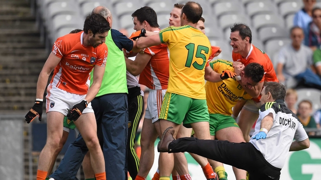 9 August - 'The flying doctor' - Armagh's Aaron Findon pushes Donegal team doctor Kevin Moran during a first-half altercation
