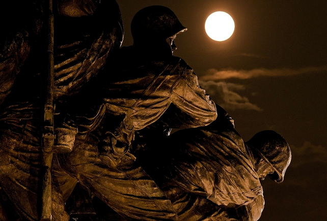 The supermoon rises above the US Marine Corps War Memorial in Arlington, Virginia
