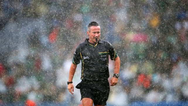 Referee James McGrath has some difficult calls to make with conditions making things that much more difficult
