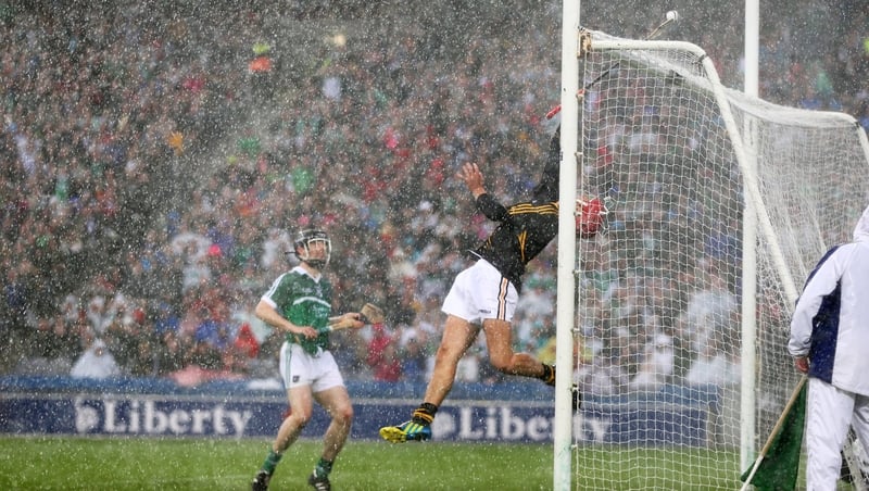 The sliotar just goes over Kilkenny goalkeeper David Herity and the bar