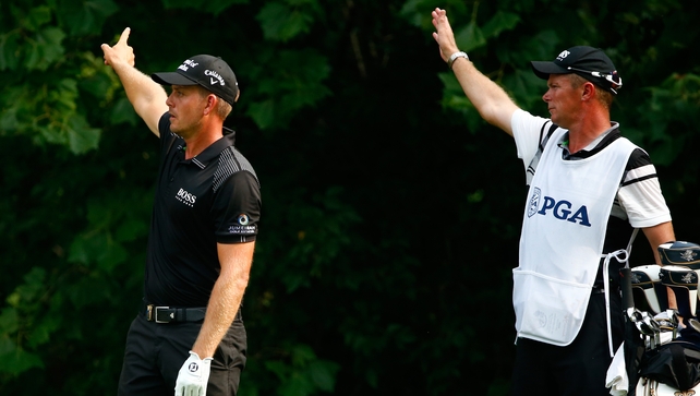 FORE! Henrik Stenson and his caddie signal a rare wayward shot - the Swede took just 30 shots for his front nine