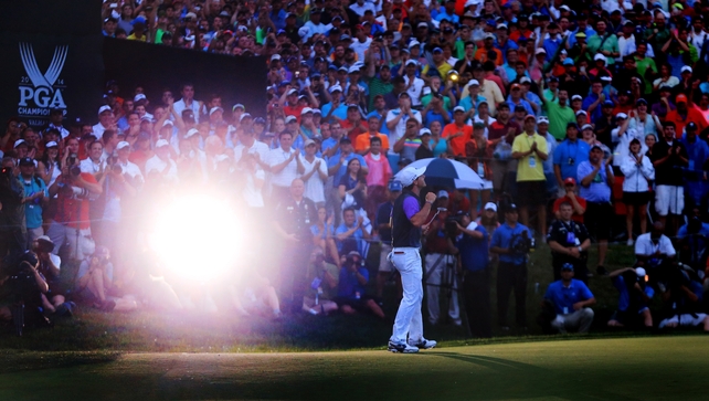 In near-darkness, McIlroy holes the winning putt
