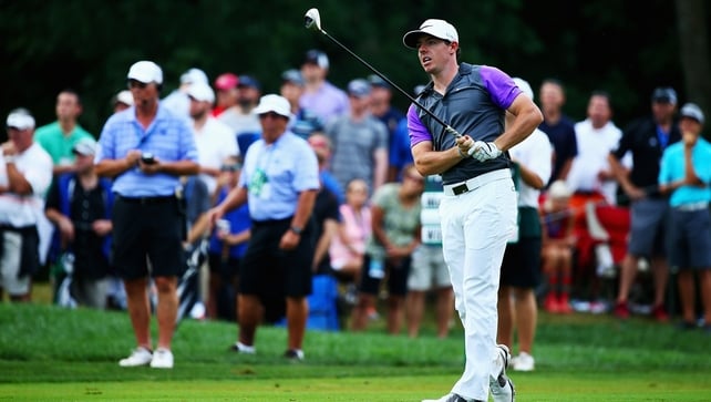 The key shot: McIlroy watches his 3-wood cut streak down the left of the par-five tenth hole
