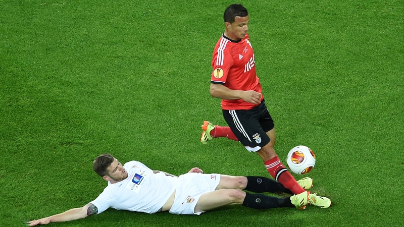 Alberto Moreno is at full stretch to tackle Benfica's Rodrigo Lima during the Europa League final