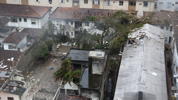 Damaged buildings where the aircraft crashed in the residential area Na Rua Vahia de Abreu in Santos