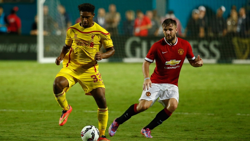 Jordon Ibe of Liverpool under pressure from Man United's Luke Shaw