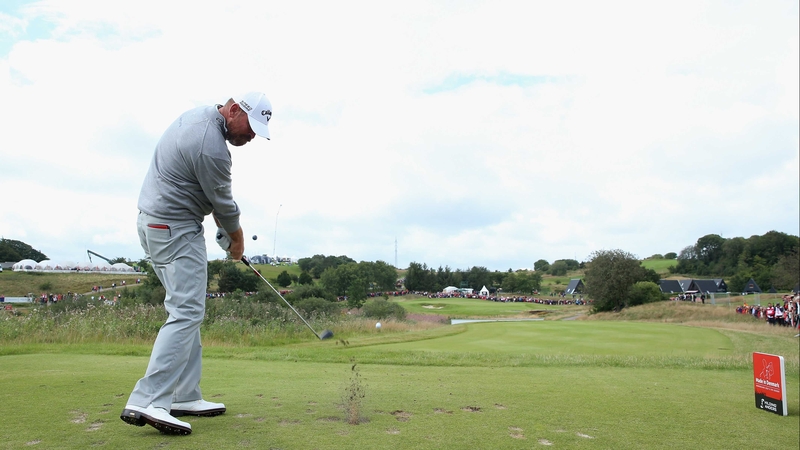 Thomas Bjorn of Denmark hits his tee-shot on the second hole
