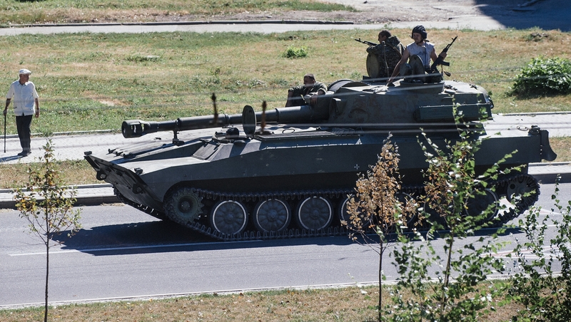 A pro-Russian tank moving along a street in Donetsk