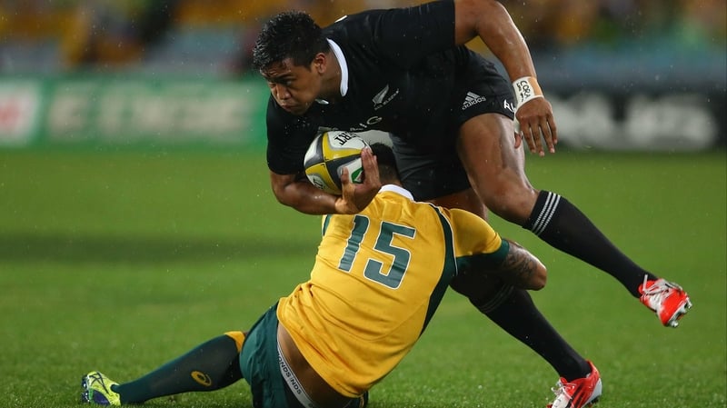 Australia's Israel Folau tackles Julian Savea of the All Blacks
