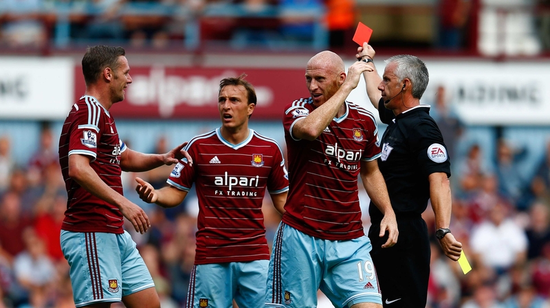 James Collins of West Ham reacts after receiving a red card for his second bookable offence