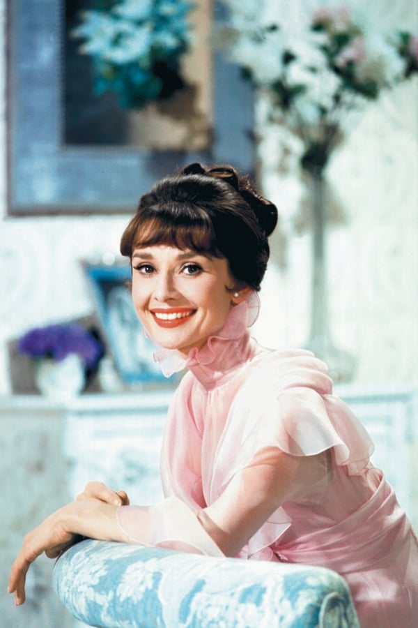 Audrey Hepburn inBefore work for "Paris When It Sizzles" has begun, Audrey poses in the garden of the villa the Ferrers have rented for the duration of the shooting. The palatial abode has its own lake with swans. My Fair Lady