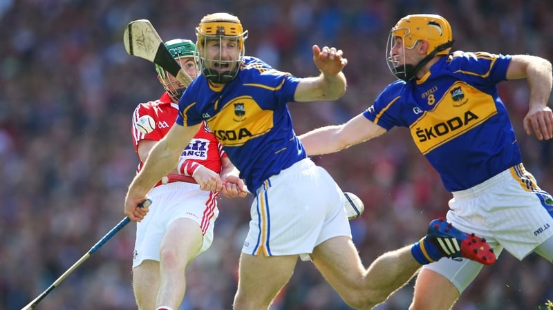Cork's Daniel Kearney is under pressure to clear the ball as the Tipperary duo of Kieran Bergin and Shane McGrath advance