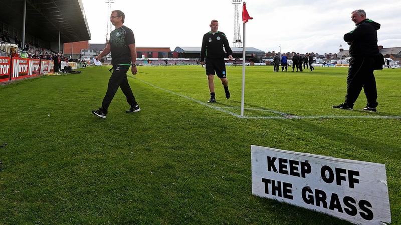 Shamrock Rover boss looking unhappy walking off the "unsafe" Dalymount Park surface