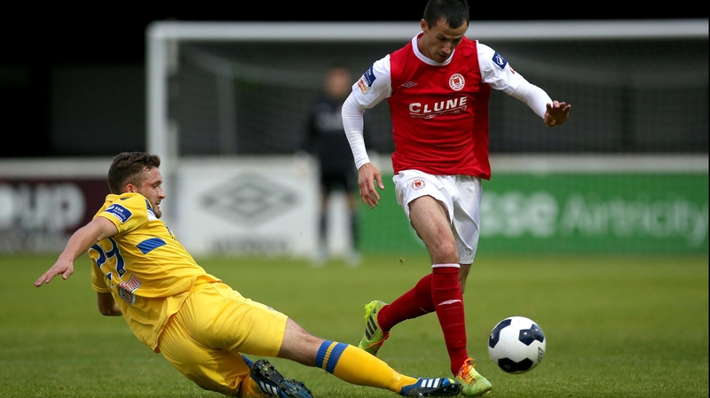 Jason Hughes slides in on Keith Fahey