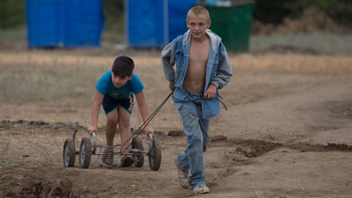 Children from eastern Ukraine, play in a refugee camp near Donetsk