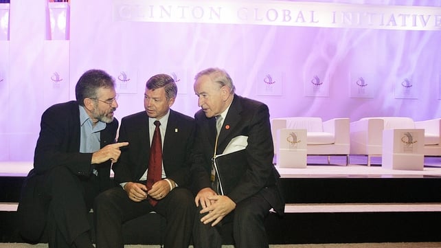 Norway's Prime Minister Kjell Magne Bondevik (C) speaks with Gerry Adams (L) and Albert Reynolds after attending the session 'Bringing and end to War' at the Clinton Global Initiative forum in 2005