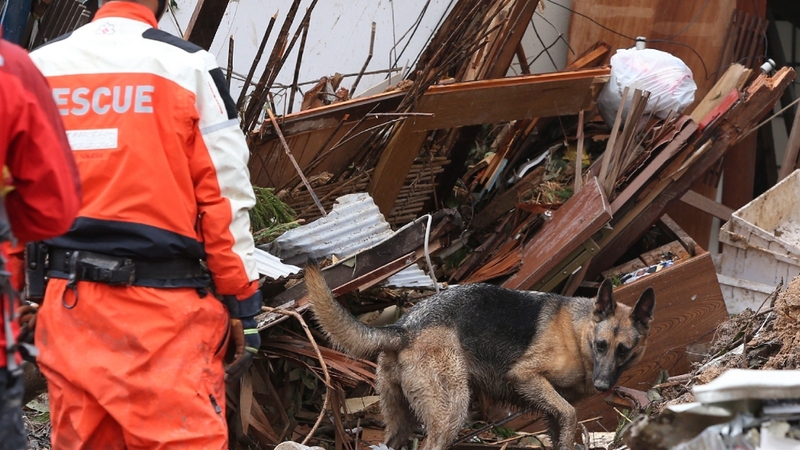 Heavy rain triggered landslides early Wednesday that swallowed dozens of homes