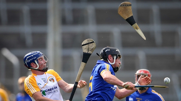 Antrim's Darragh McGuinness breaks the hurley of Clare's Gearoid O'Connell