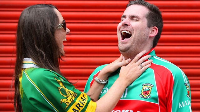 Kerry supporter Julie Brick from Tralee and Mayo supporter Damien Ruddy from Glenamoy joke around before the game