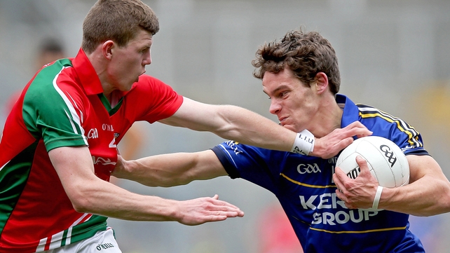 Tomas O Sé of Kerry with Conor Kilkenny of Mayo face off in the minor semi-final