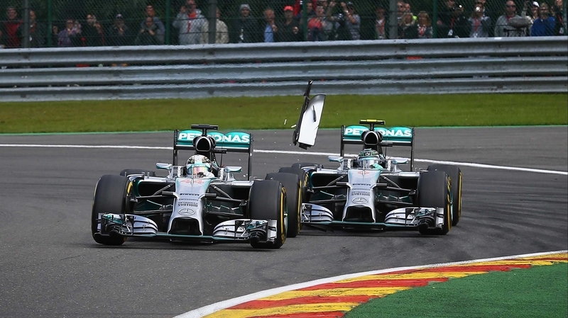 Team-mates Lewis Hamilton (L) and and Nico Rosberg collided in just the second lap
