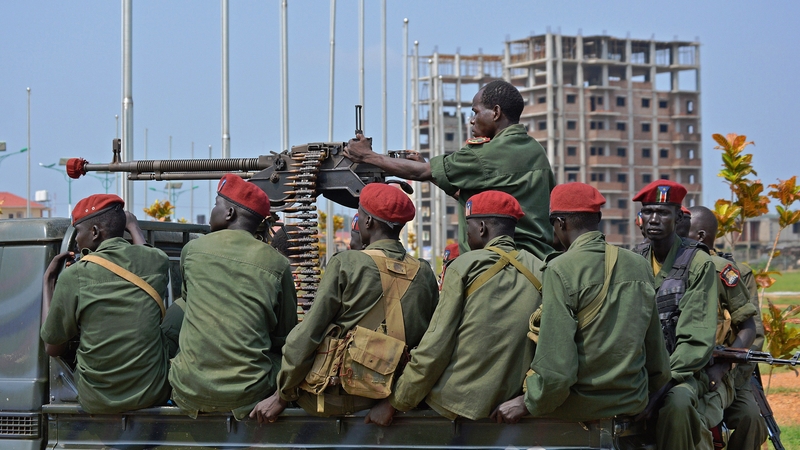 South Sudanese soldiers secure a road near the airport in Juba, South Sudan's capital