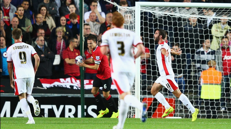 Will Grigg of Milton Keynes Dons celebrates scoring the opening goal