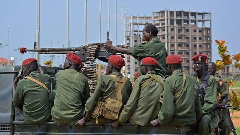 South Sudanese soldiers secure a road near the airport in Juba, South Sudan's capital