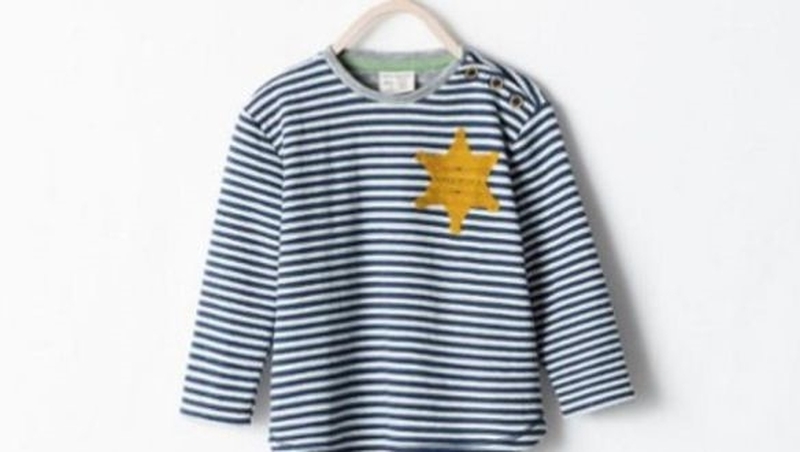 The striped top featured a golden six-pointed star stitched onto the upper left hand side